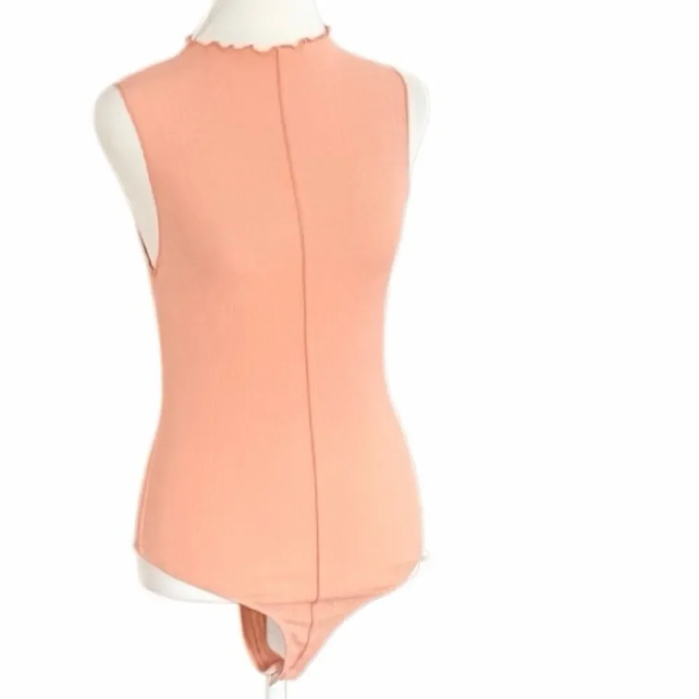New with tag 21 Saints Peach Sleeveless Thong Bodysuit size Small.